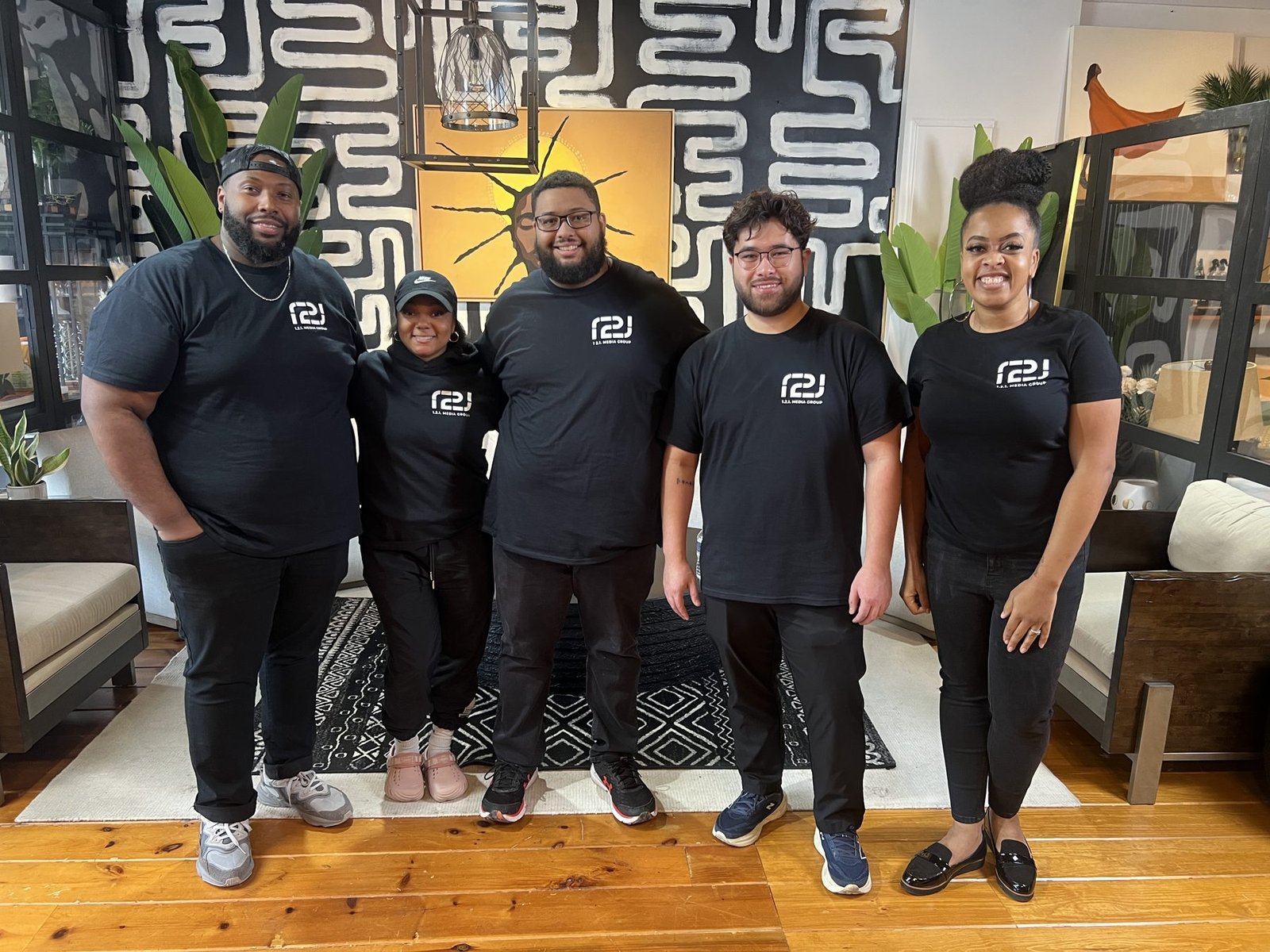 The 121 Media Group team in matching black 121 Media Group t-shirts