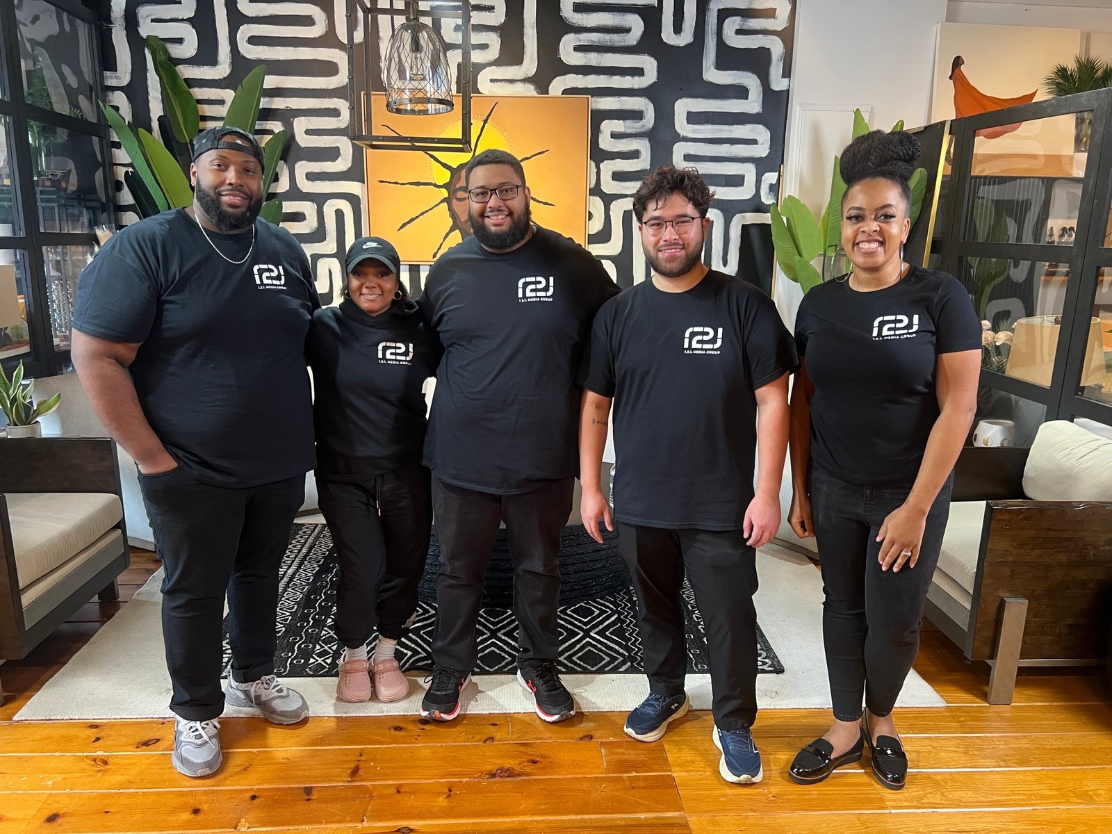 The 121 Media Group team in matching black 121 Media Group t-shirts