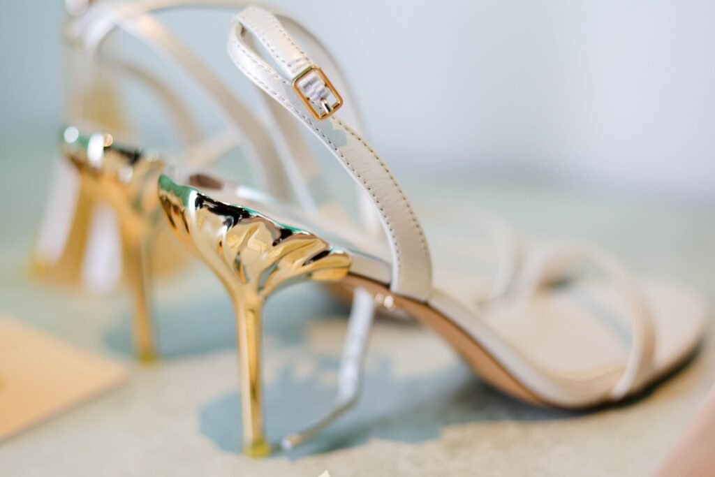 Bridal heels with gold accents, detail shot — photographed by 121 Media Group