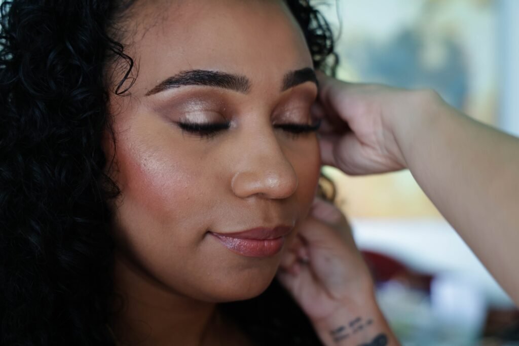 Close-up of the bride during final makeup touches — photographed by 121 Media Group