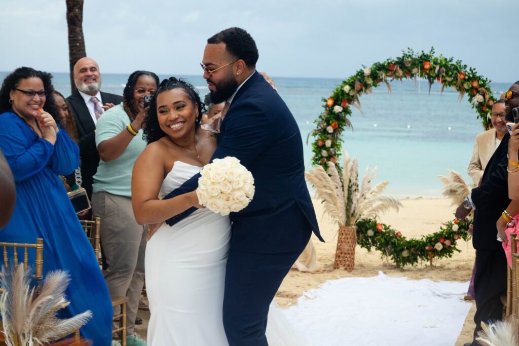 Newlyweds celebrating with guests after the ceremony — photographed by 121 Media Group