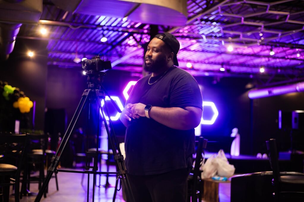 Video production set with a cinema camera and neon lighting