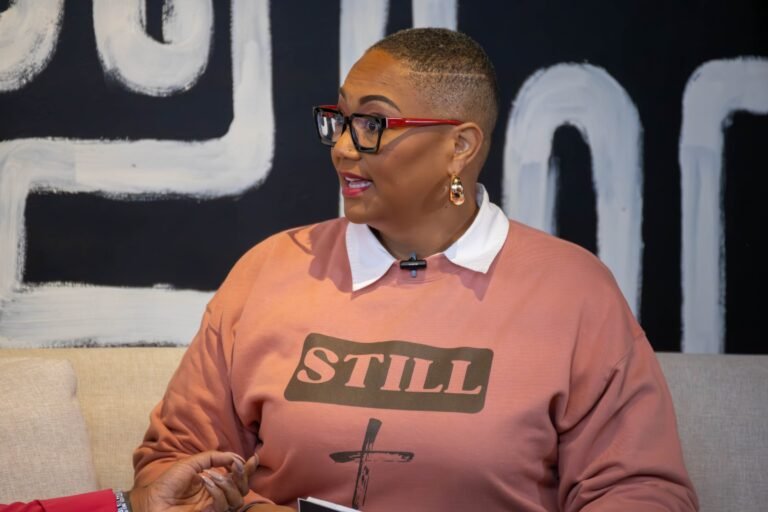 Podcast guest mid-conversation on set in a STILL sweatshirt — photographed by 121 Media Group