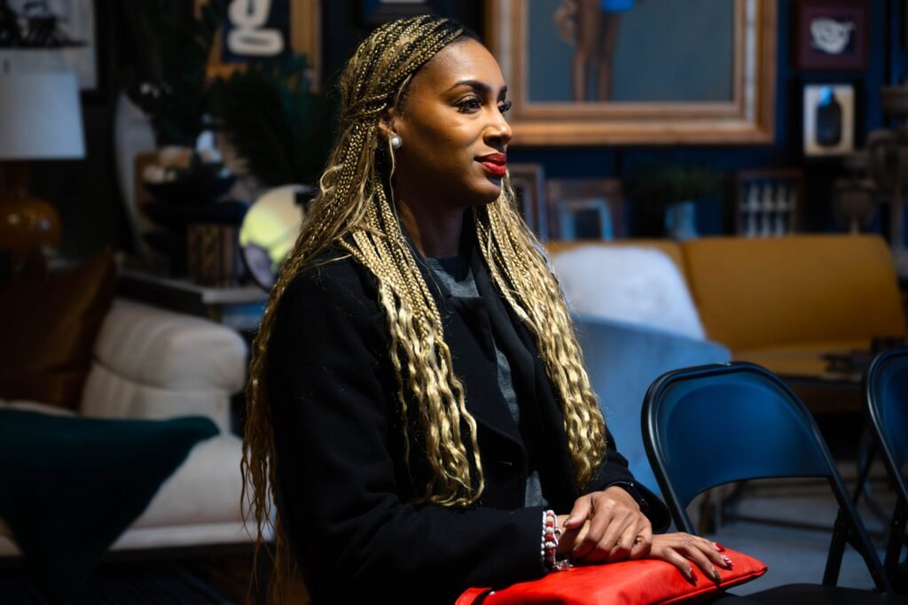 Audience member seated during a podcast taping, candid portrait — photographed by 121 Media Group